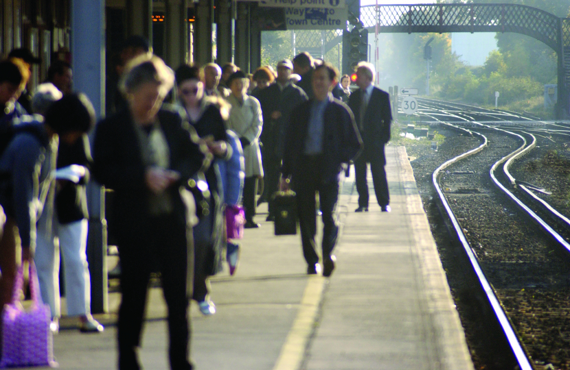 Image of commuters on platform